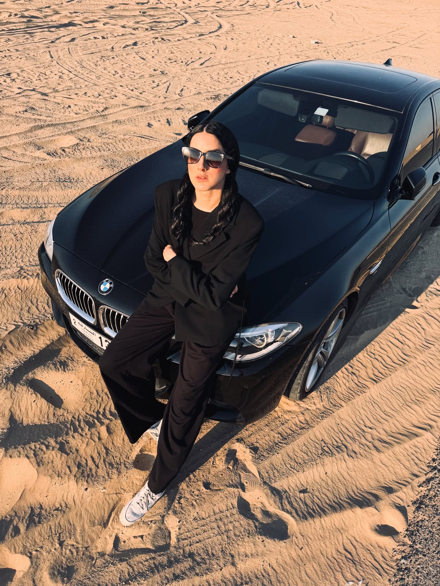 On the BMW hood at golden hour